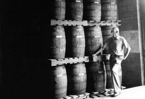 A former Caroni worker photographed near the casks